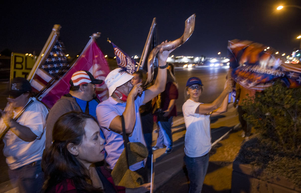 Pastor Brando Madrigal blows a shofar in support of President Donald Trump as protests continue ...