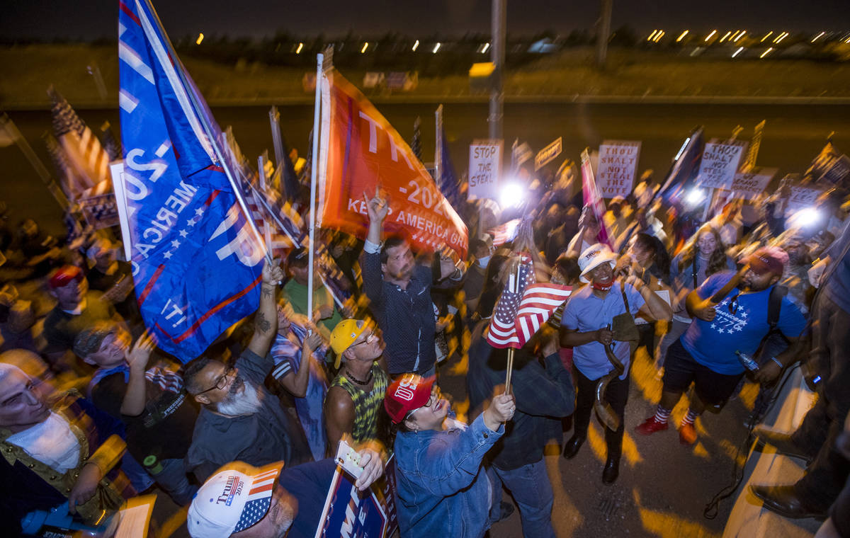 Protesters in support of President Donald Trump continue chanting outside the Clark County Elec ...