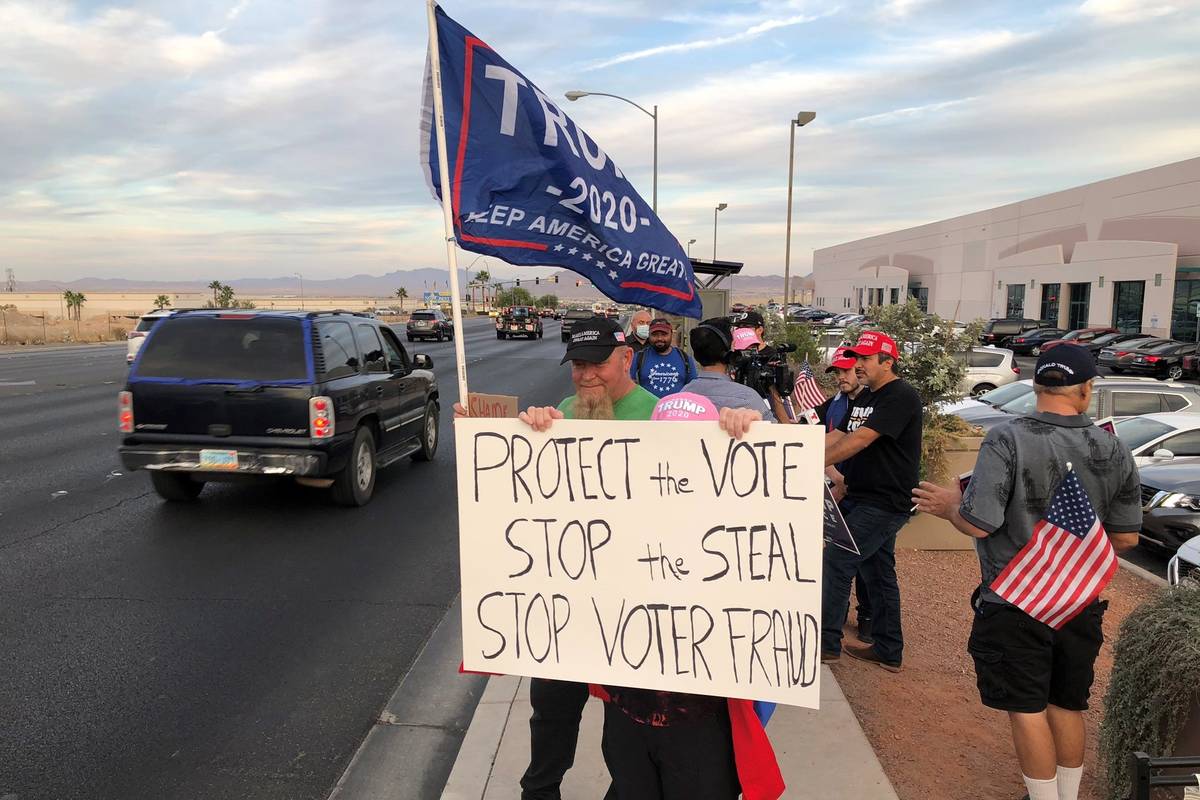 Protesters are seen outside the Clark County Election Building in North Las Vegas on Thursday, ...