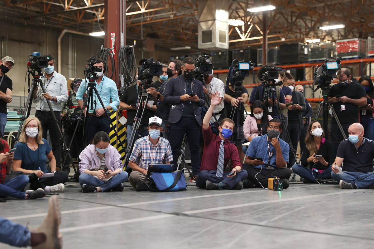 Members of the press listen to Clark County Registrar of Voters Joe Gloria speak during a press ...