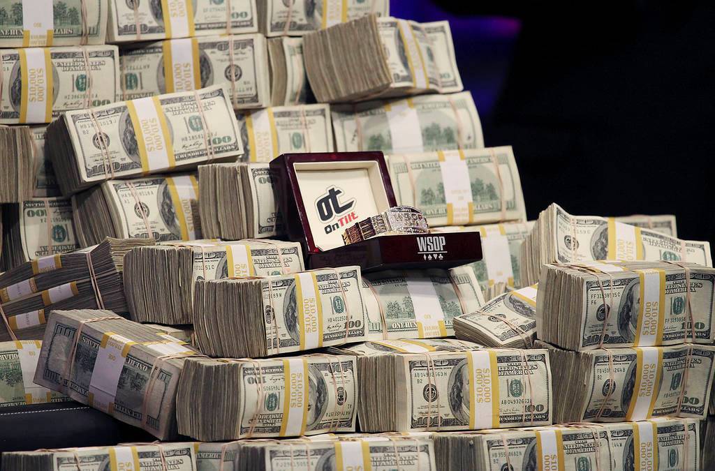 The 2011 WSOP Championship Bracelet is displayed along with bundles of cash during the World Se ...