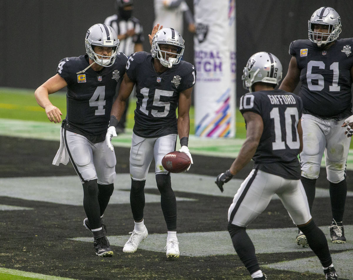Las Vegas Raiders wide receiver Nelson Agholor (15) celebrates his touchdown with quarterback D ...