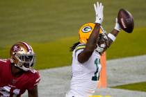 Green Bay Packers wide receiver Davante Adams, right, celebrates after catching a touchdown pas ...