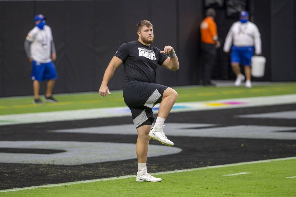 Las Vegas Raiders offensive tackle Kolton Miller (74) warms up before an NFL football game agai ...