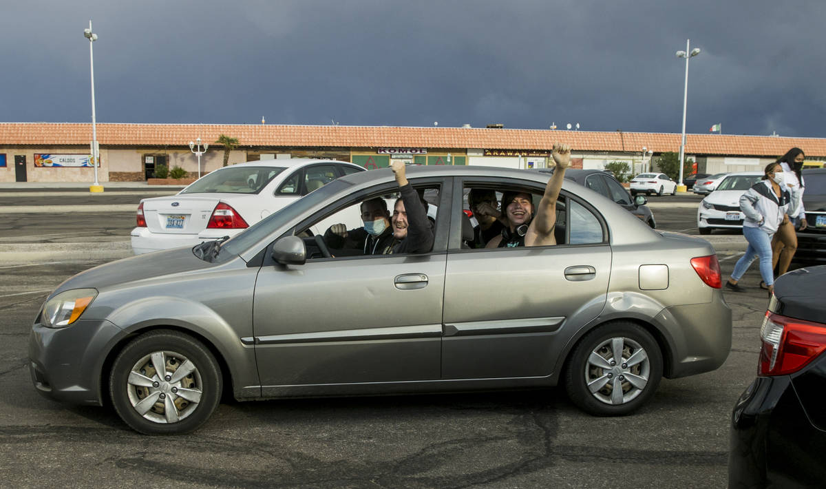 Attendees cheer while leaving for a car parade down the Las Vegas Strip to celebrate former Vic ...
