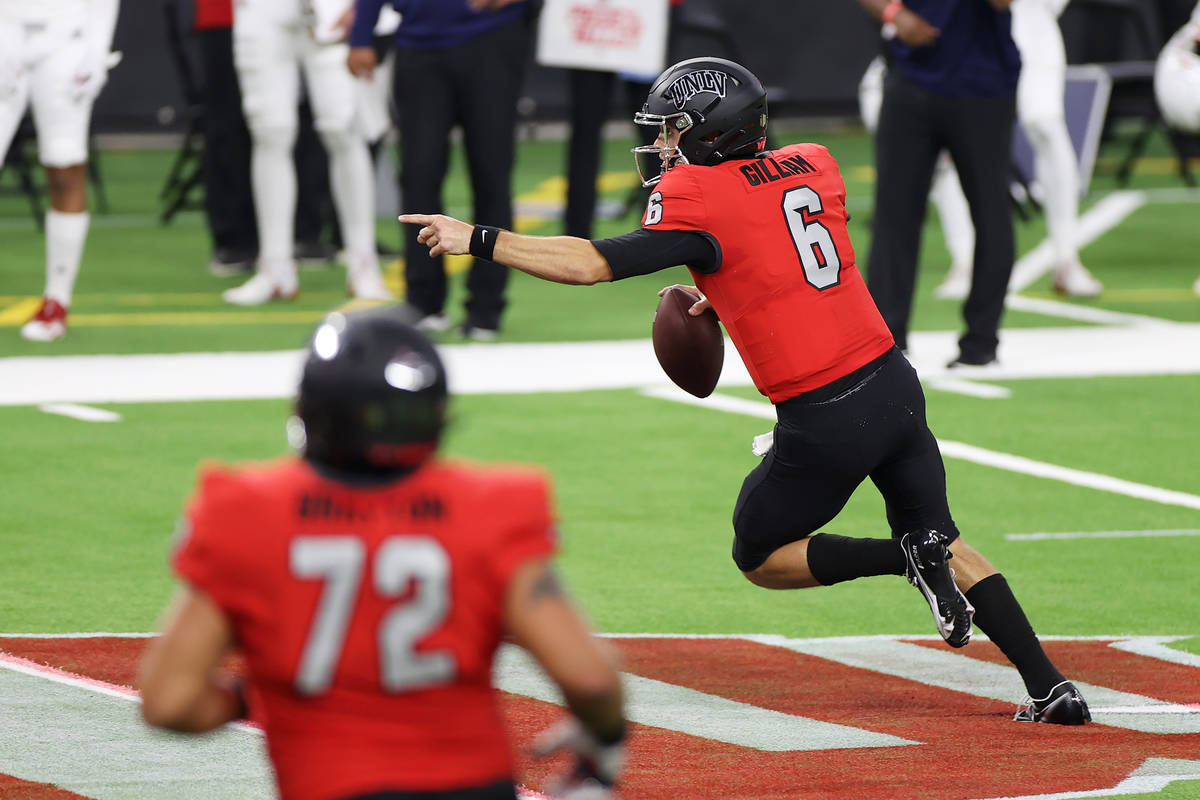 UNLV Rebels quarterback Max Gilliam (6) looks for an open pass after breaking a tackle during t ...