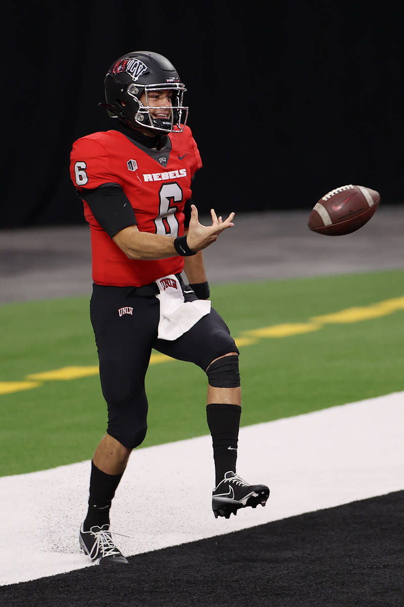 UNLV Rebels quarterback Max Gilliam (6) celebrates a rushing touchdown against the Fresno State ...
