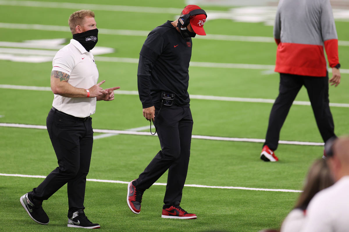 UNLV Rebels head coach Marcus Arroyo, center, lowers his head after his team gave away an inter ...