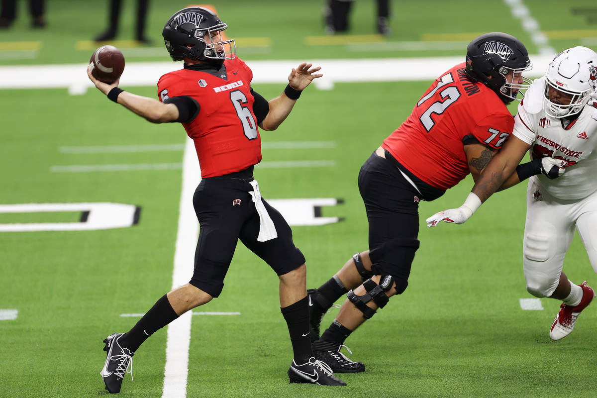 UNLV Rebels quarterback Max Gilliam (6) gets ready to throw a pass as offensive lineman Matt Br ...