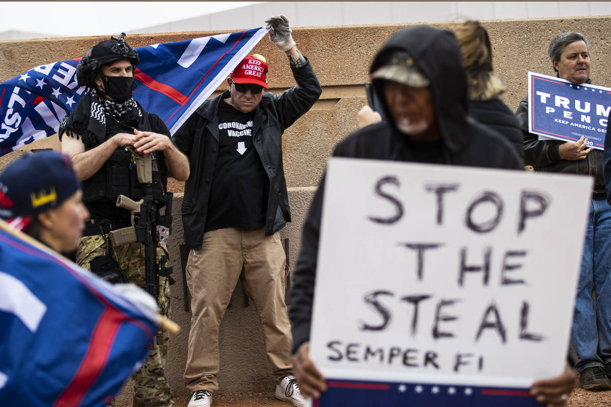 Supporters of President Donald Trump protest outside of the Clark County Election Department af ...