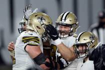 New Orleans Saints tight end Adam Trautman, center, celebrates with offensive tackle Ryan Ramcz ...