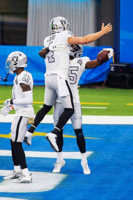 Las Vegas Raiders wide receiver Nelson Agholor (15) celebrates his touchdown score with quarter ...