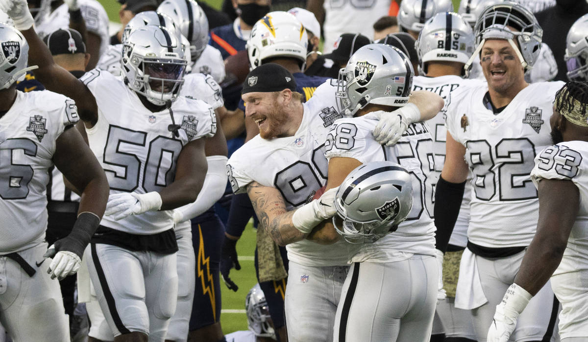 Las Vegas Raiders defensive end Maxx Crosby (98) and Las Vegas Raiders linebacker Kyle Wilber ( ...