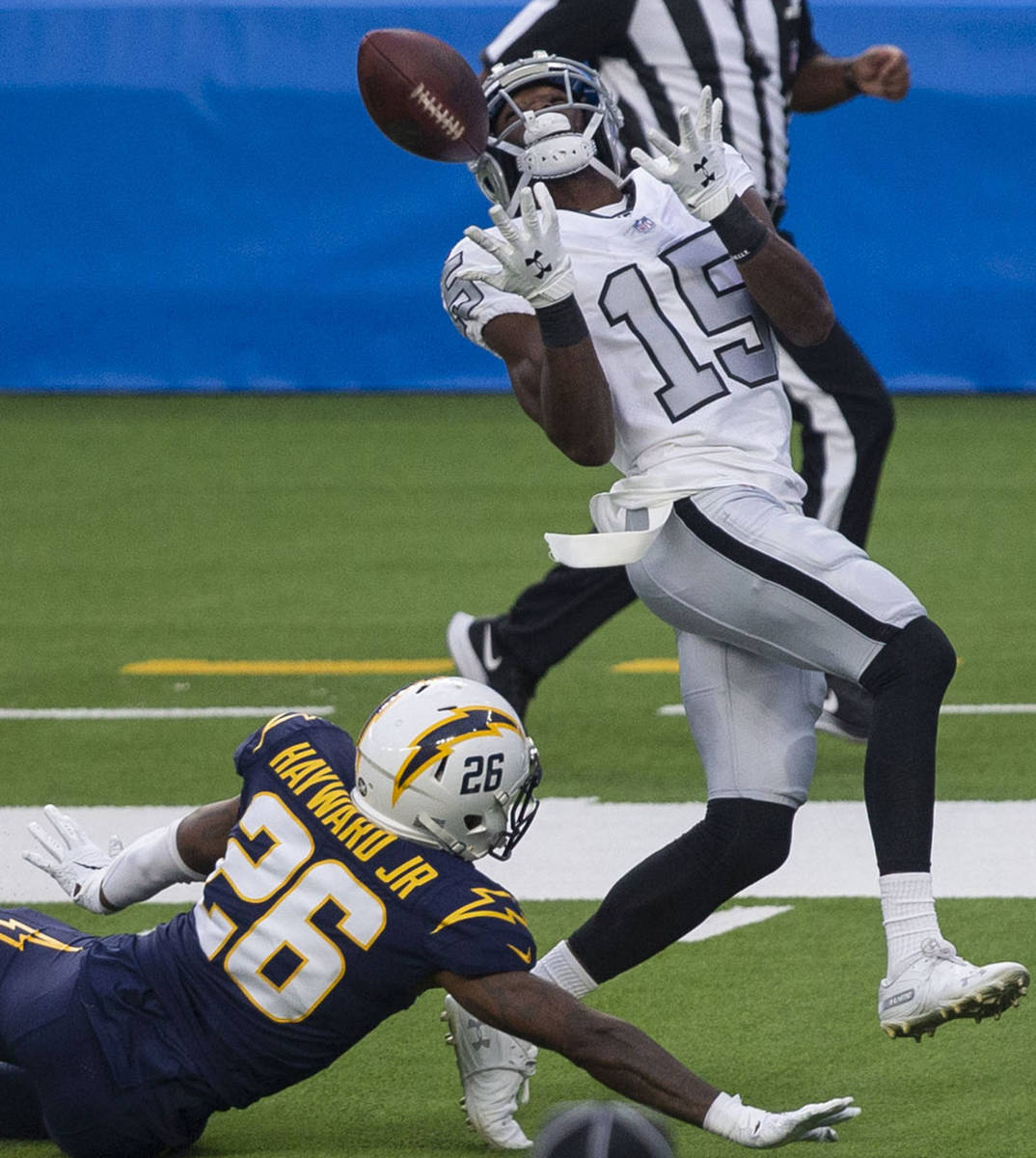Las Vegas Raiders wide receiver Nelson Agholor (15) prepares to make a catch over Los Angeles C ...