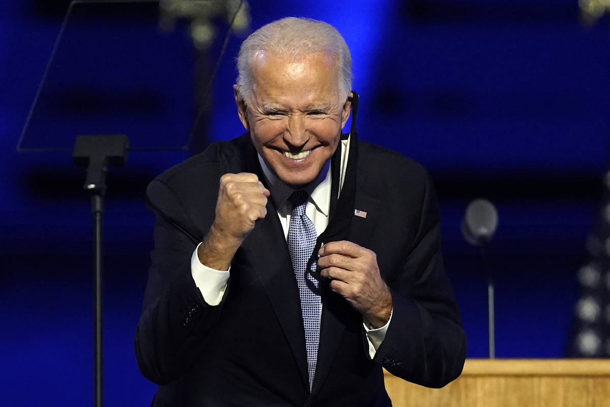 President-elect Joe Biden gestures to supporters Saturday, Nov. 7, 2020, in Wilmington, Del. (A ...
