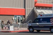 Individuals exit the free walk-up COVID-19 testing offered at the Strip Pavilion Room within UN ...