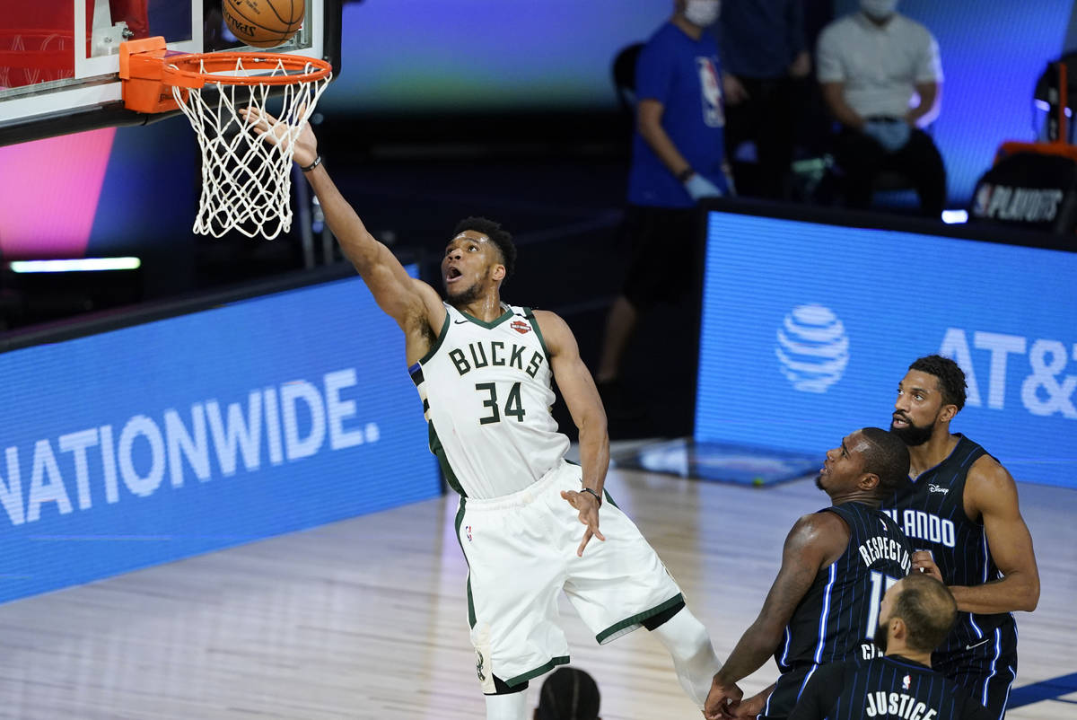 Milwaukee Bucks' Giannis Antetokounmpo (34) drives to the basket during the first half of an NB ...