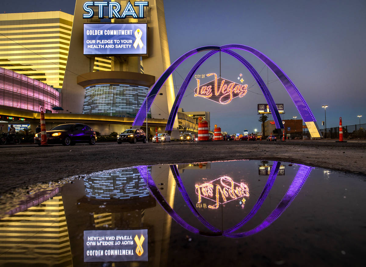 The night falls as the downtown gateway arches are fully illuminated for the first time about T ...