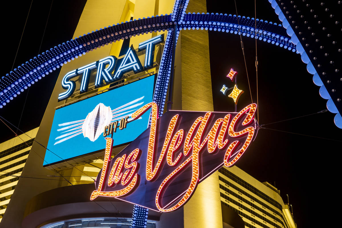 The downtown gateway arches are fully illuminated for the first time about The Strat on Wednesd ...