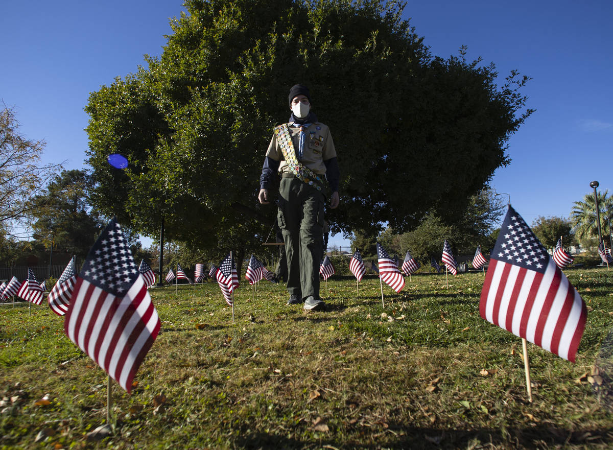 Seamus Smith, senior patrol leader of Boys Scouts of America Troop 208, walks at the Garden of ...