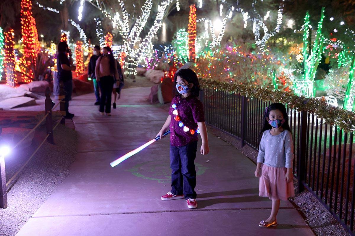 Maddox Macabenta, 7, and his sister Mila, 5, during the Ethel M Chocolates 27th Annual Holiday ...