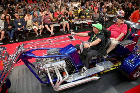 Dana Mecum, founder and president of Mecum Auctions, right takes a ride on a 2006 LV Trike cust ...