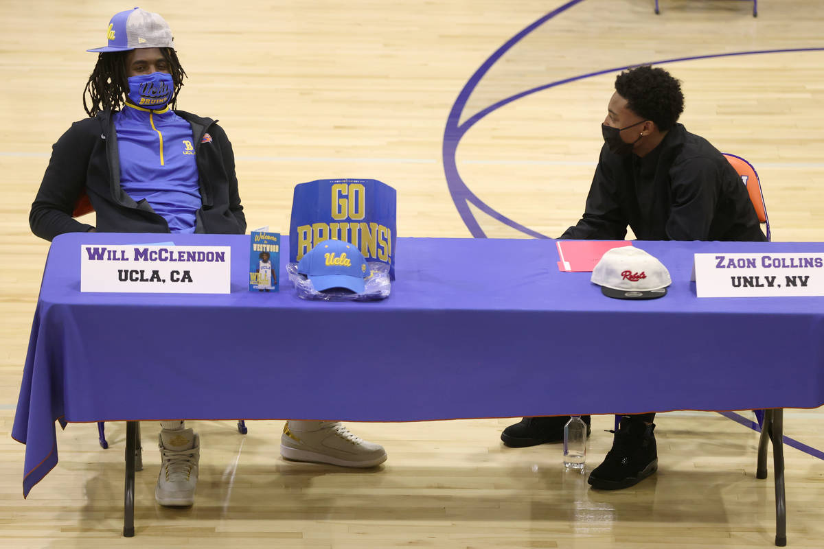 Will McClendon, left, and Zaon Collins, participate during a Signing Day ceremony at Bishop Gor ...