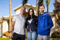 Danielle Wood, center, poses with her husband, Brian, and son, Nate, 17, at their home in Las V ...