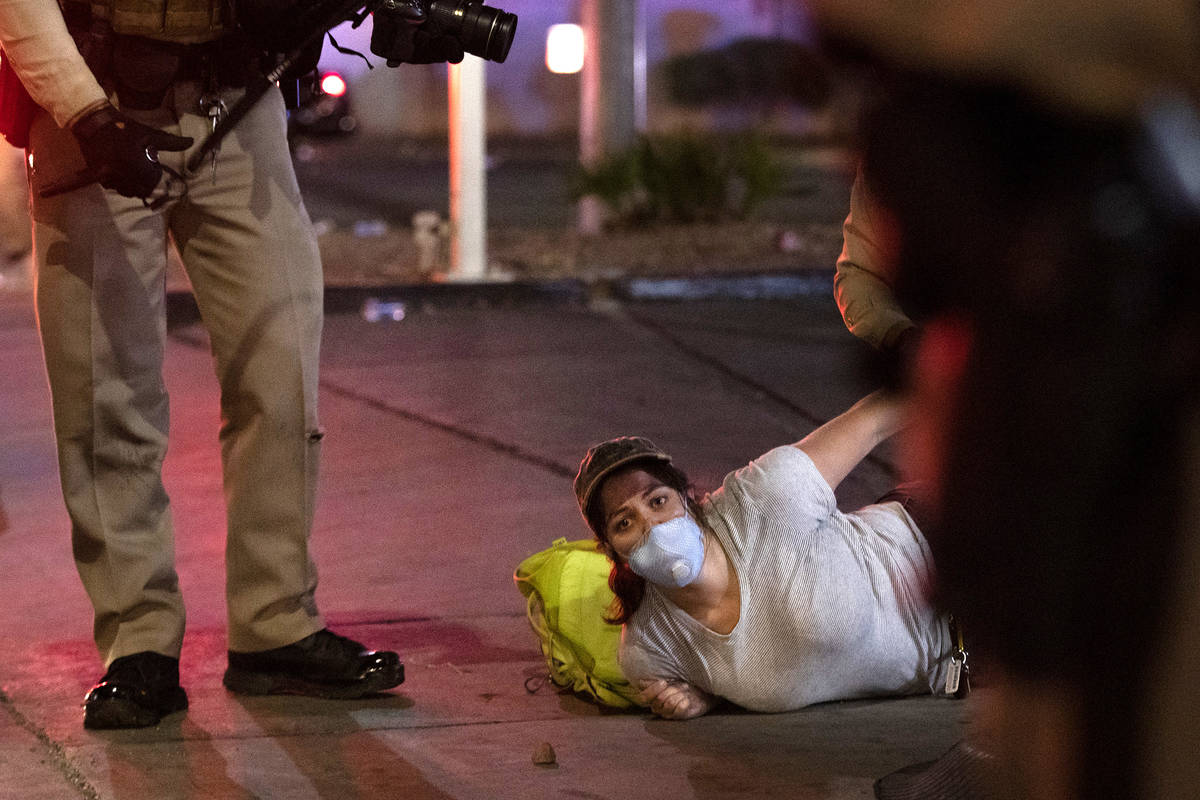 Photojournalist Bridget Bennett is arrested by Metropolitan Police officers while covering a pr ...