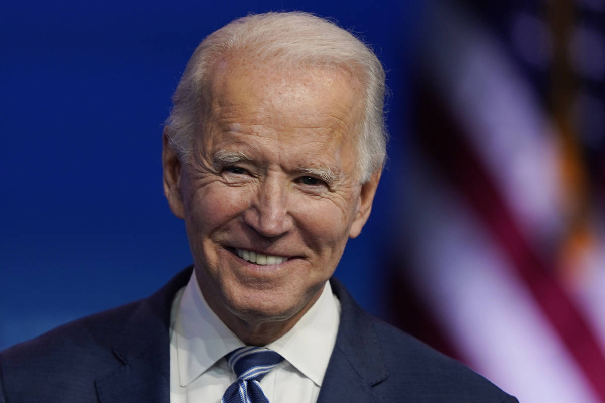 President-elect Joe Biden pauses as listens to media questions at The Queen theater, Tuesday, N ...