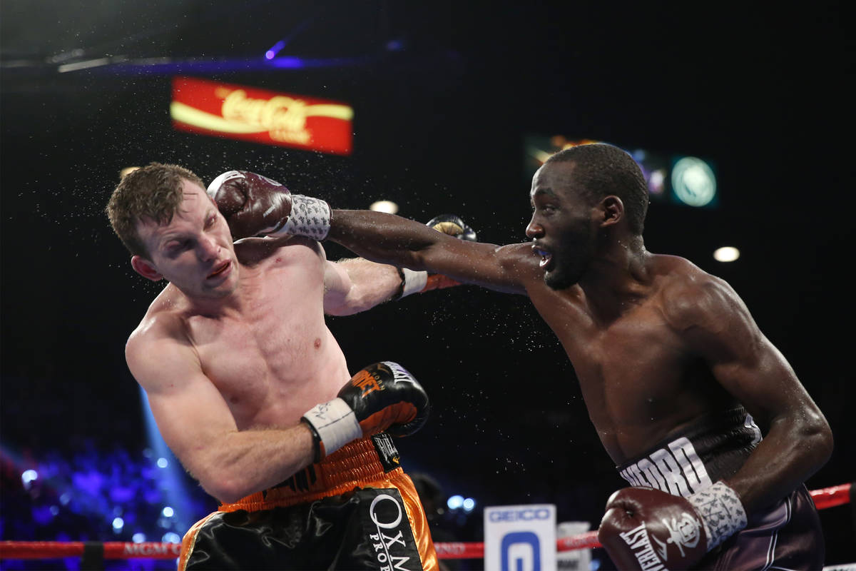 Terence Crawford, right, connects a punch against Jeff Horn in the WBO welterweight World Title ...