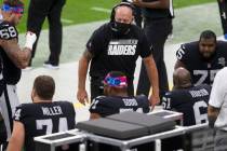 Las Vegas Raiders offensive line coach Tom Cable speaks to the offensive linemen on the sidelin ...