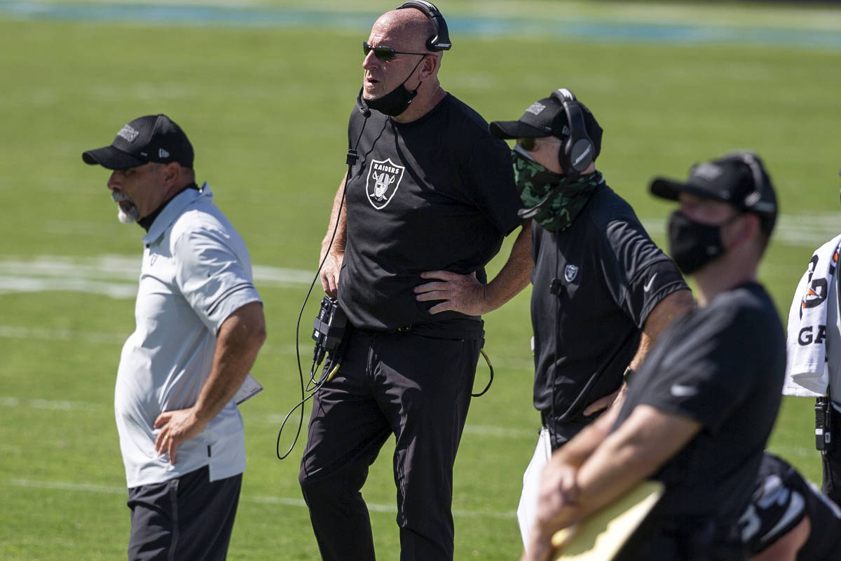 Las Vegas Raiders coaches, from left, Rich Bisaccia, Tom Cable and Rod Marinelli coach from the ...