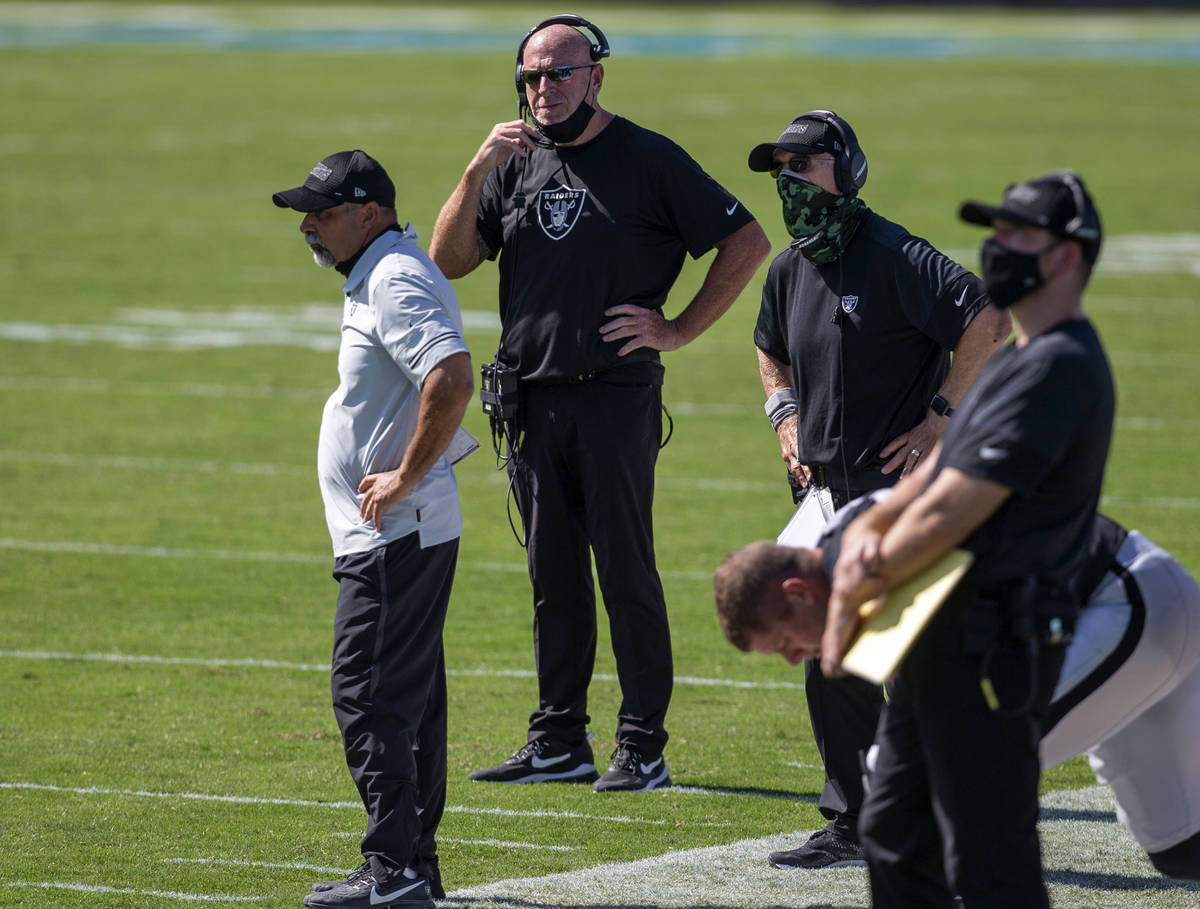 Las Vegas Raiders coaches, from left, Rich Bisaccia, Tom Cable and Rod Marinelli coach from the ...