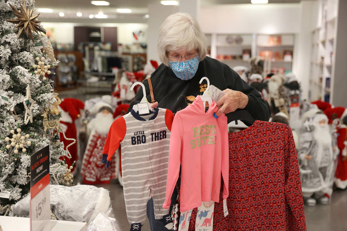 Carol Ratliff of Washington state shops for gifts at J. C. Penney, 4485 S Grand Canyon, in Las ...