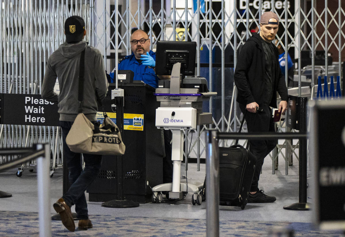 Passengers stop by a Transportation Security Administration checkpoint at McCarran Internationa ...