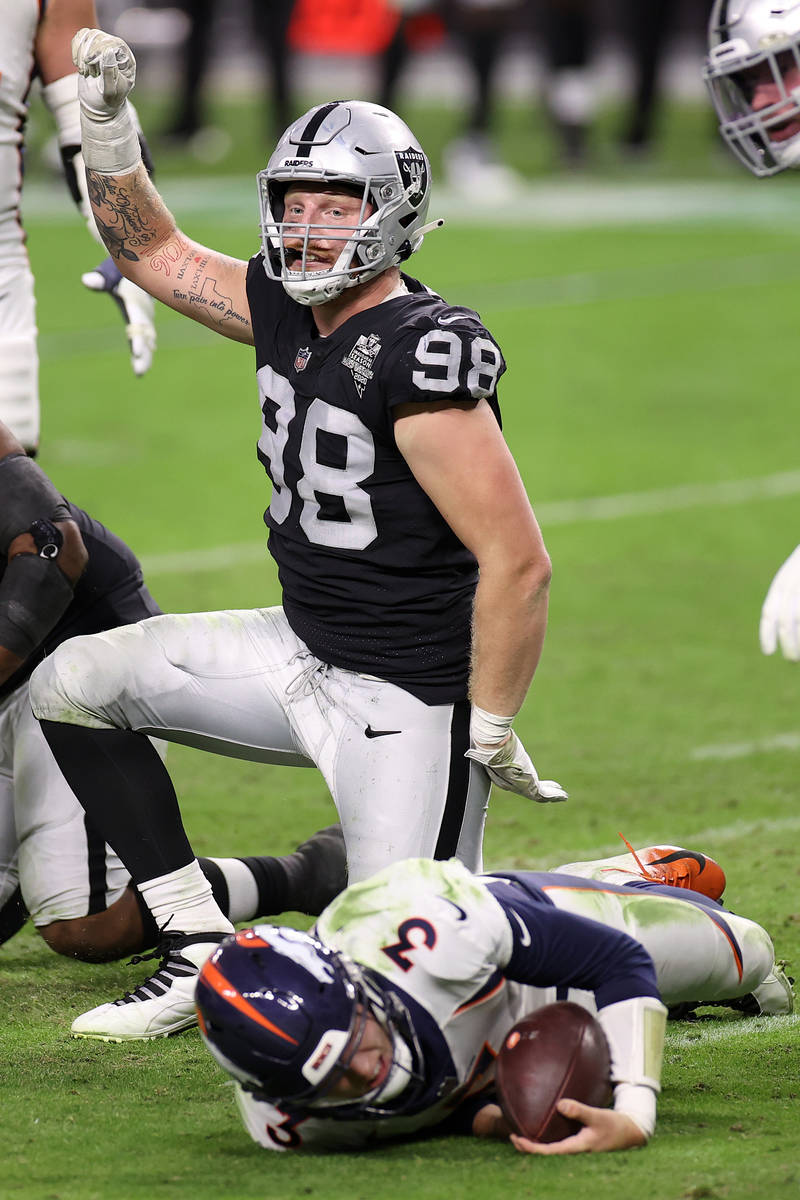 Las Vegas Raiders defensive end Maxx Crosby (98) reacts after sacking Denver Broncos quarterbac ...