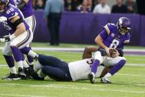 Minnesota Vikings quarterback Kirk Cousins (8) is sacked by Chicago Bears nose tackle Eddie Gol ...