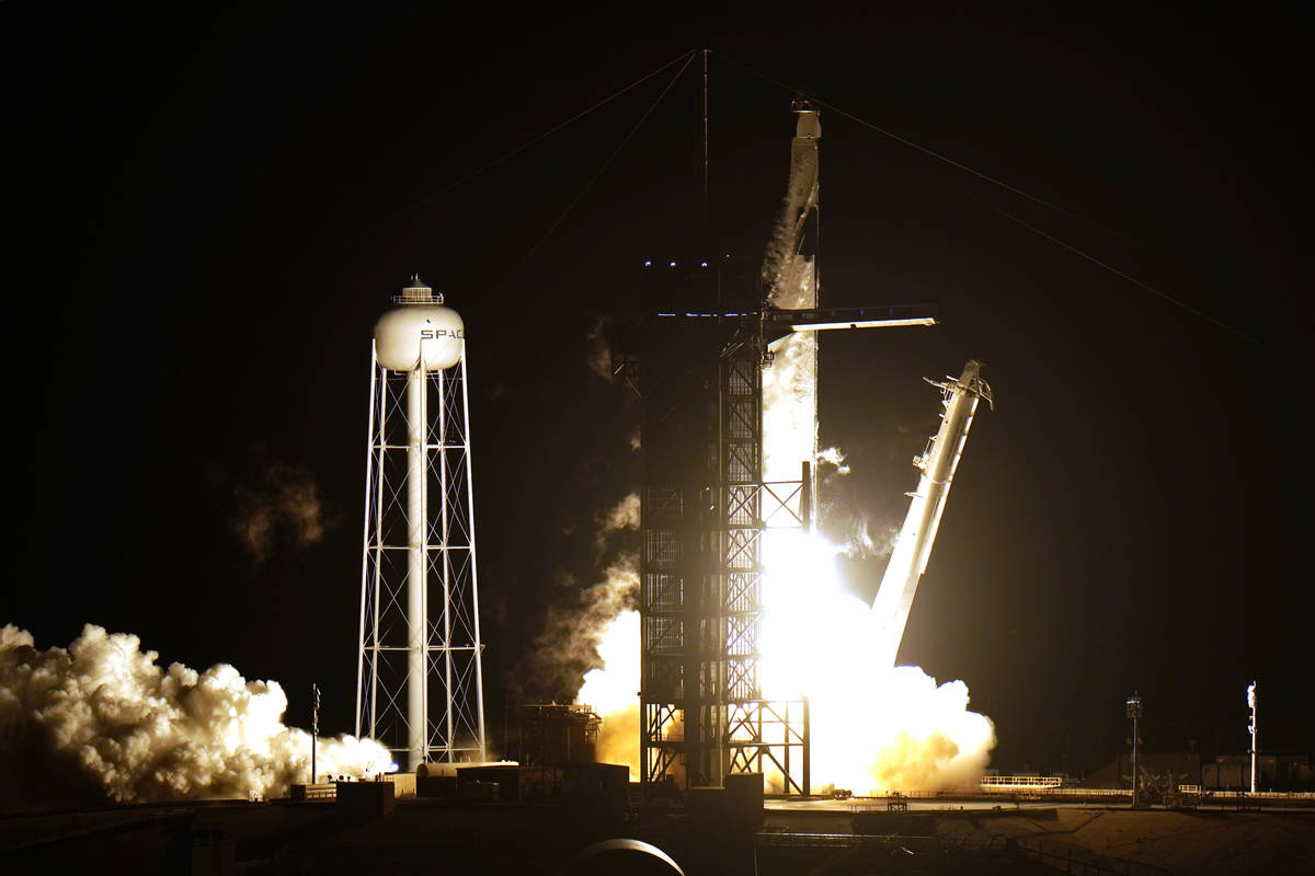 A SpaceX Falcon9 rocket, with the Crew Dragon capsule attached, lift's off from Kennedy Space C ...