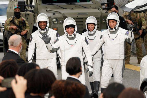 NASA astronauts, from left, Victor Glover, Michael Hopkins, Shannon Walker, and Japan Aerospace ...