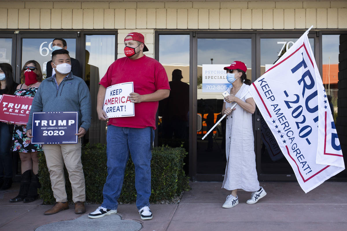 Supporters of Donald Trump attend a Nevada GOP press conference announcing a new elections laws ...