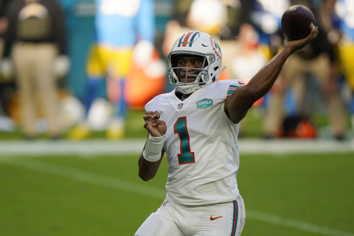 Miami Dolphins quarterback Tua Tagovailoa (1) looks to pass the football during the first half ...