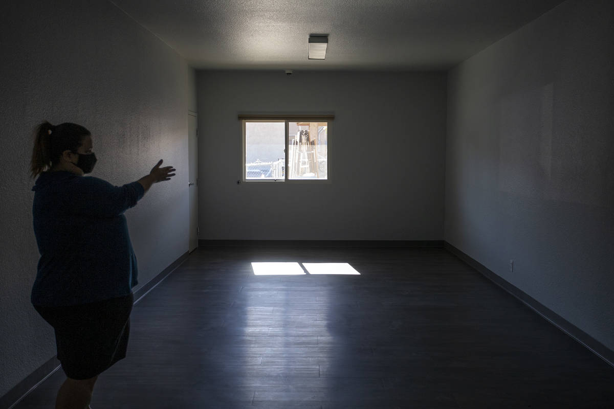 Alyson Martinez, director of programming at Las Vegas Rescue Mission, shows the renovated women ...