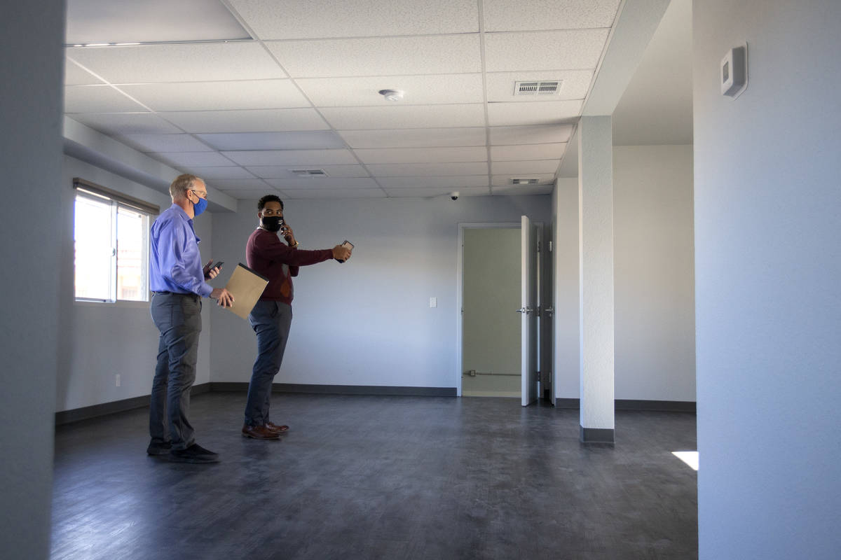 Dwayne Wright II, shelter superviser at Las Vegas Rescue Mission, shows the renovated women's f ...