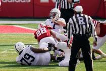 Nebraska linebacker Luke Reimer (28) brings down Penn State quarterback Will Levis (7) during a ...