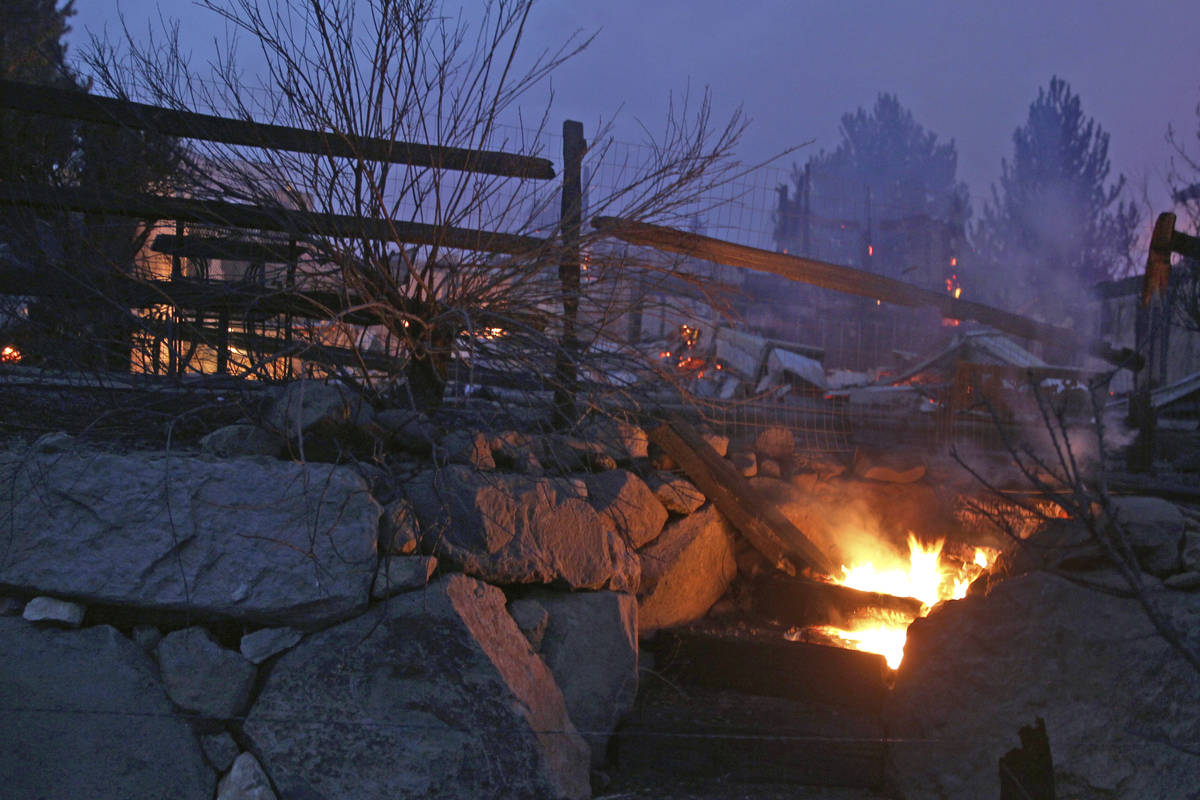 Wooden steps burn after wildfires in Southwest Reno, destroyed several homes in the Juniper Hil ...