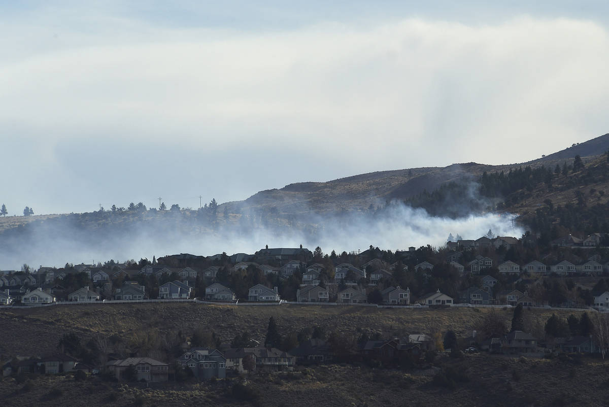 A fire is seen burning in the Caughlin Ranch area of Reno, Nev., on Tuesday, Nov. 17, 2020. Fir ...