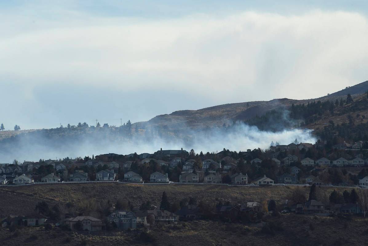 A fire is seen burning in the Caughlin Ranch area of Reno, Nev., on Tuesday, Nov. 17, 2020. Fir ...