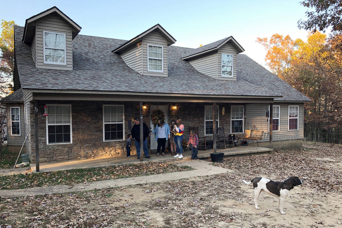 The Michael family gathers outside their home on Friday, Nov. 13, 2020, in Jonesboro, Ark. Amon ...