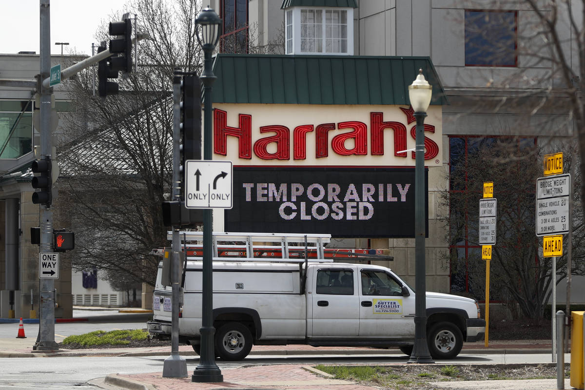 A marquee sign reminds residents of Joliet, Ill., that Harrah's Casino on the Des Plaines River ...
